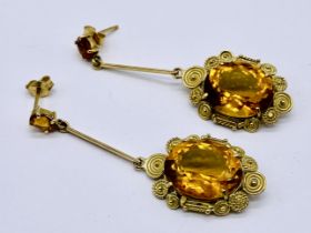 A pair of tested 18ct gold and citrine drop earrings- approx. weight (excluding large stone) 9.6g