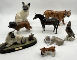 A collection of Beswick and other animal figures including large tiger, bay horse, St Bernard etc.