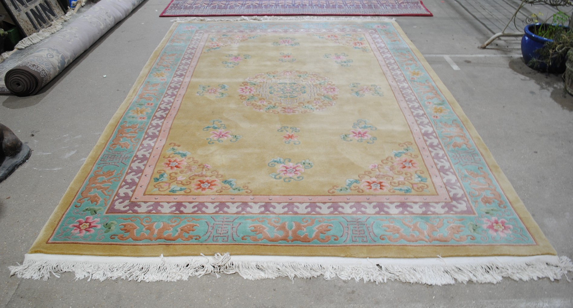 A large Chinese yellow ground rug - 318cm x 218cm
