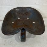 A vintage weathered tractor seat