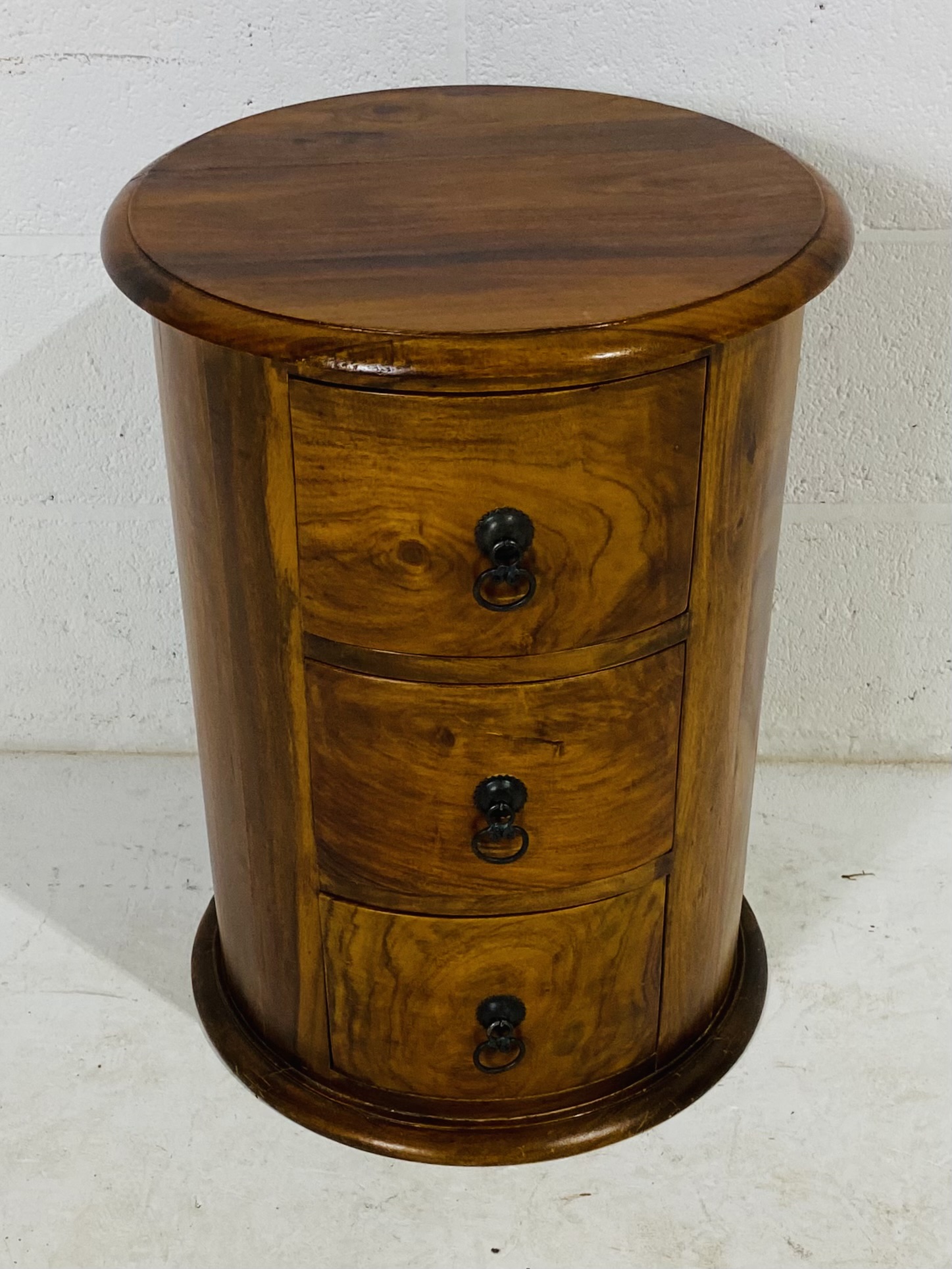 A cylindrical bedside set of three drawers, diameter 45cm, height 61cm