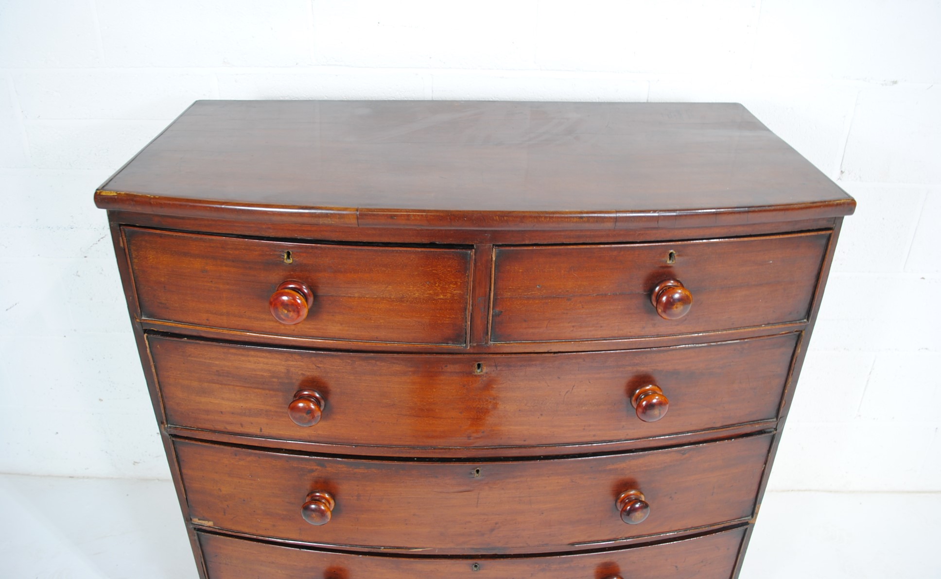 A Victorian mahogany bow-fronted chest of five drawers, raised on turned legs - one leg loose but - Image 4 of 8