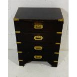 A small campaign style chest of four drawers