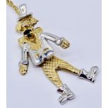 A 9ct gold articulated clown pendant on a fine 9ct gold chain, total weight 2.4g