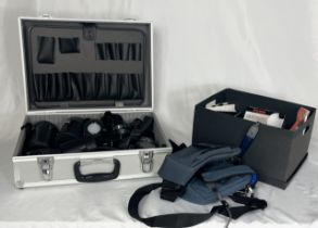 A collection of camera accessories and lenses