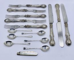 A set of six hallmarked silver coffee spoons, a silver bladed fruit knife and a part set of silver