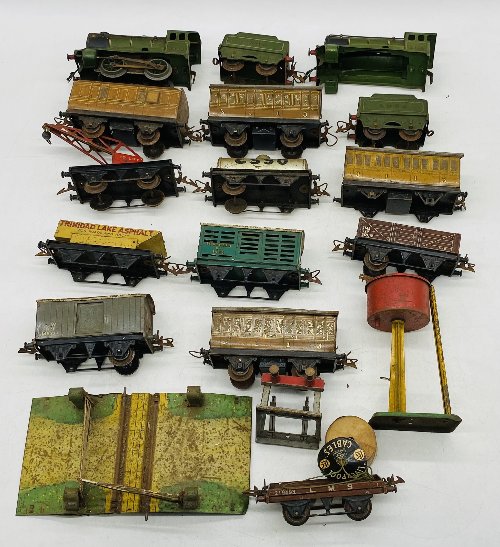 A vintage Hornby clockwork train set including locomotive, tender, rolling stock, tankers,