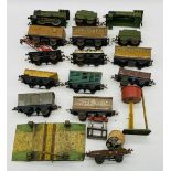A vintage Hornby clockwork train set including locomotive, tender, rolling stock, tankers,