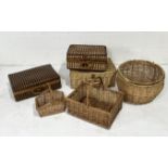 A collection of wicker baskets, picnic baskets, woven bamboo suitcase