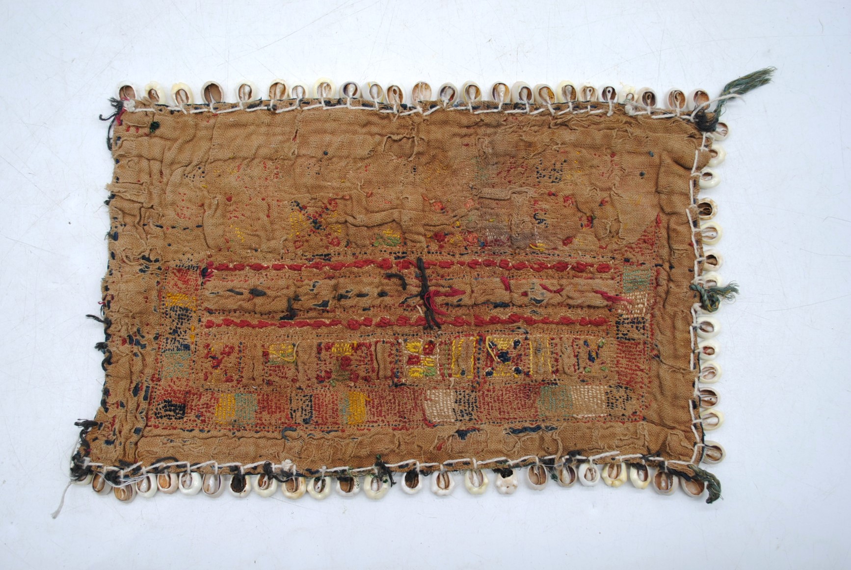 A Banjara nomadic Indian textile head-covering, with geometric designs and cowrie shell border, - Image 3 of 7