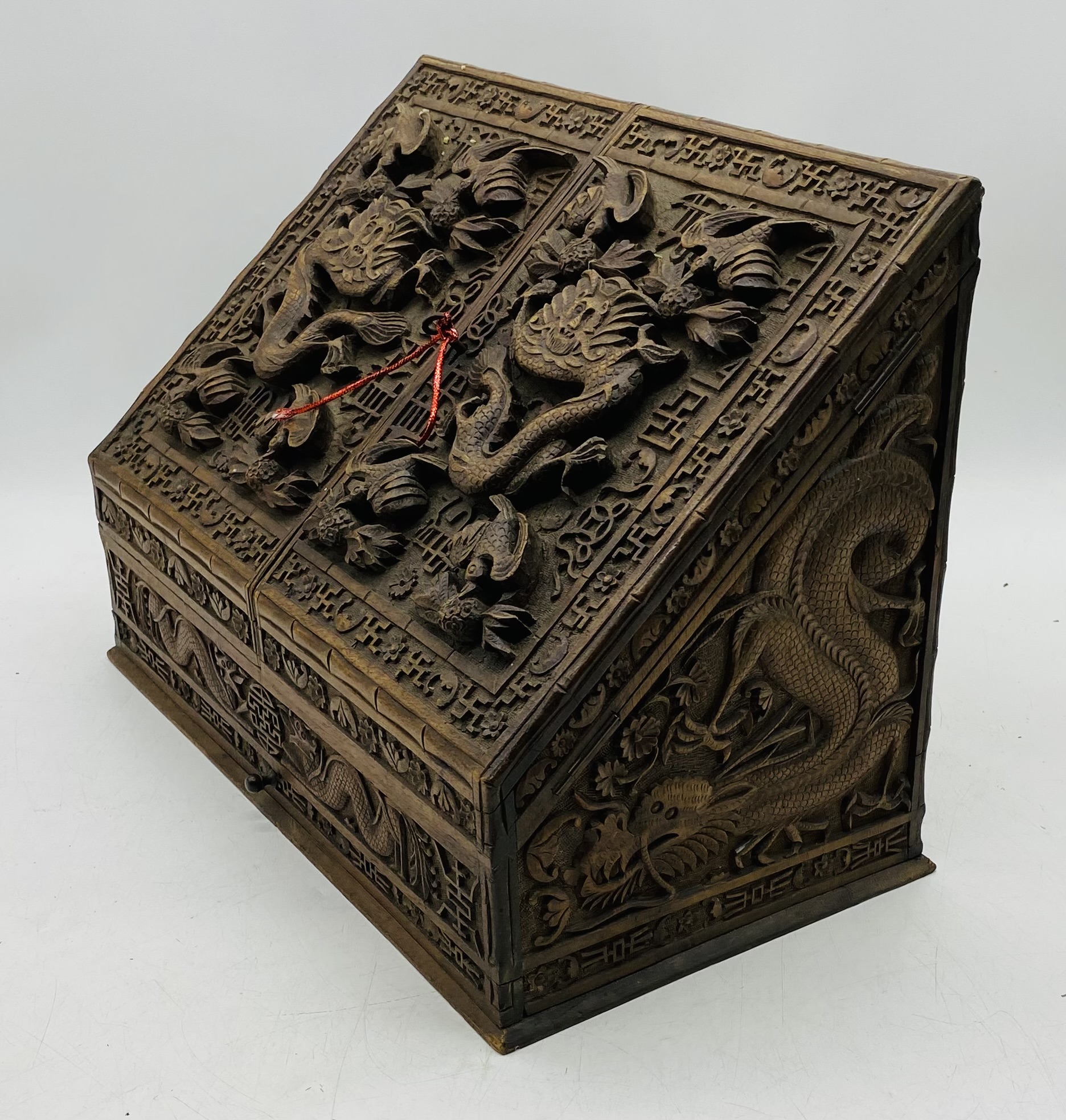 An Oriental heavily carved hardwood stationary box, with key - length 44cm, depth 24cm, height 31cm - Image 5 of 7