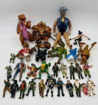 A collection of mainly action figurines including Star Wars, Batman, VR Trooper, Adventure People