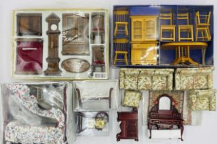 A collection of dolls house furniture including three-piece suite, kitchen set, front room set,