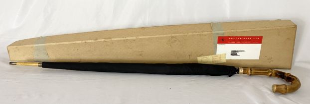 A vintage Austin Reed umbrella with bamboo handle, yellow metal collar stamped NP, the ribs marked S