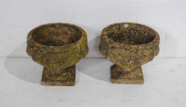 A pair of weathered reconstituted stone garden urns - diameter 37cm, height 33cm