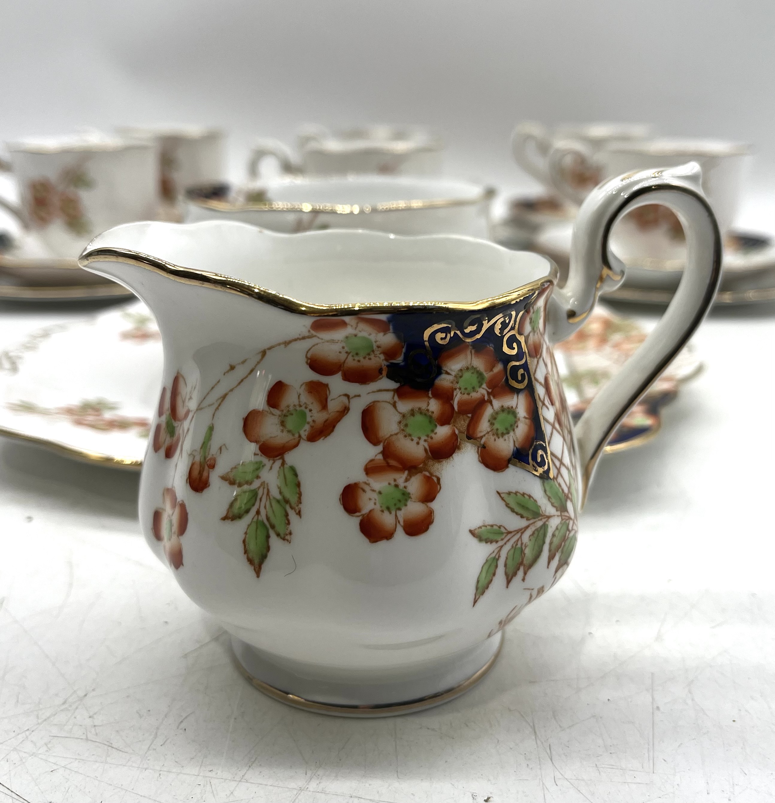 A Royal Albert Crown China tea set pattern 938015 including one sandwich plate, six trios, a milk - Image 11 of 12