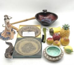An assortment of ceramics including Poole Pottery. David Melville, Coalport, ceramic fruit etc along