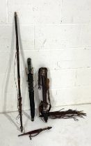 A tribal (possibly Shilluk) dagger, sword, bow and arrows (in quiver)