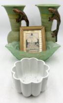 A pair of large jugs, the handles in the form of lizards along with a Shelley jelly mould, framed "