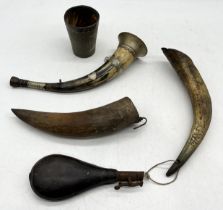 A collection of powder flask horns, horn beaker with SCM rim etc.