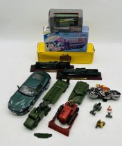 A collection of various die-cast and tinplate models including Atlas Edition "The Greatest Showman",
