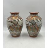 A pair of Japanese Kutani ware vases with six-character marks to base. Approximate height 30cm