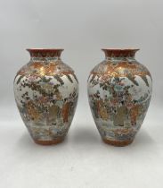 A pair of Japanese Kutani ware vases with six-character marks to base. Approximate height 30cm