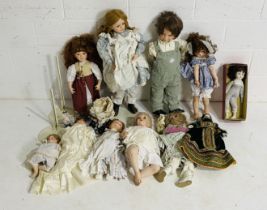 A collection of vintage collector's dolls including porcelain dolls, Alberon etc (some stands
