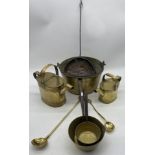 A brass jam pan, two brass watering cans, saucepans etc.