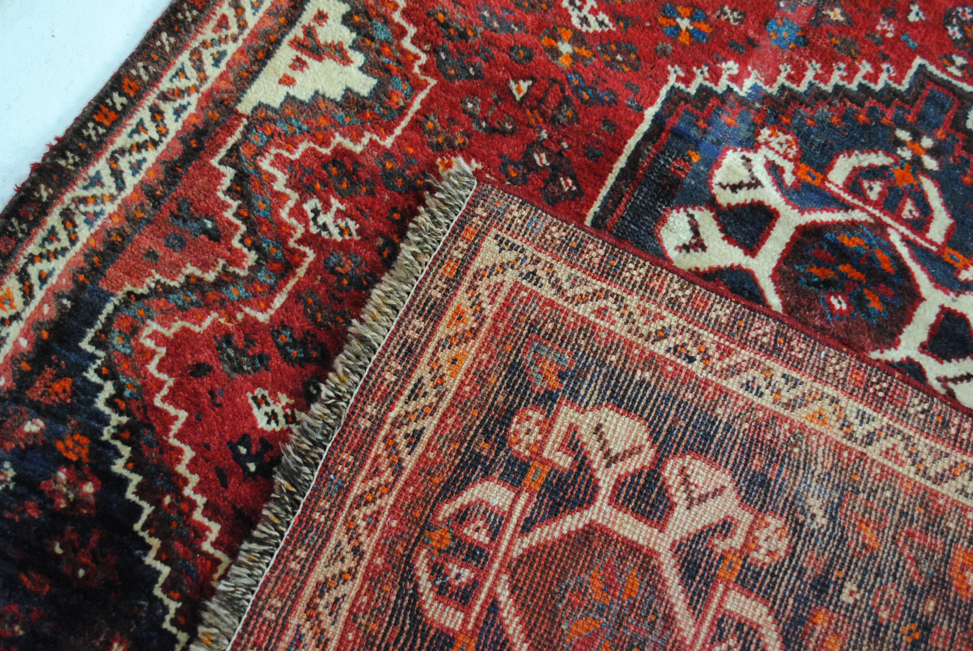 An Eastern red ground rug, with traditional designs - 173cm x 123cm - Image 7 of 8