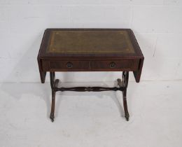 A reproduction Georgian style mahogany drop-leaf coffee table, with green leather inset top and