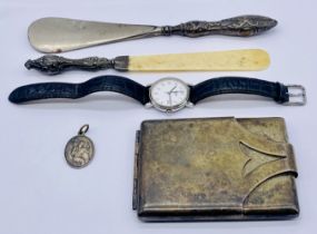 A silver plated cigarette case, Tissot watch, silver handled shoe horn and a silver St.