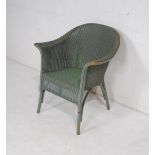 A vintage Lloyd Loom armchair
