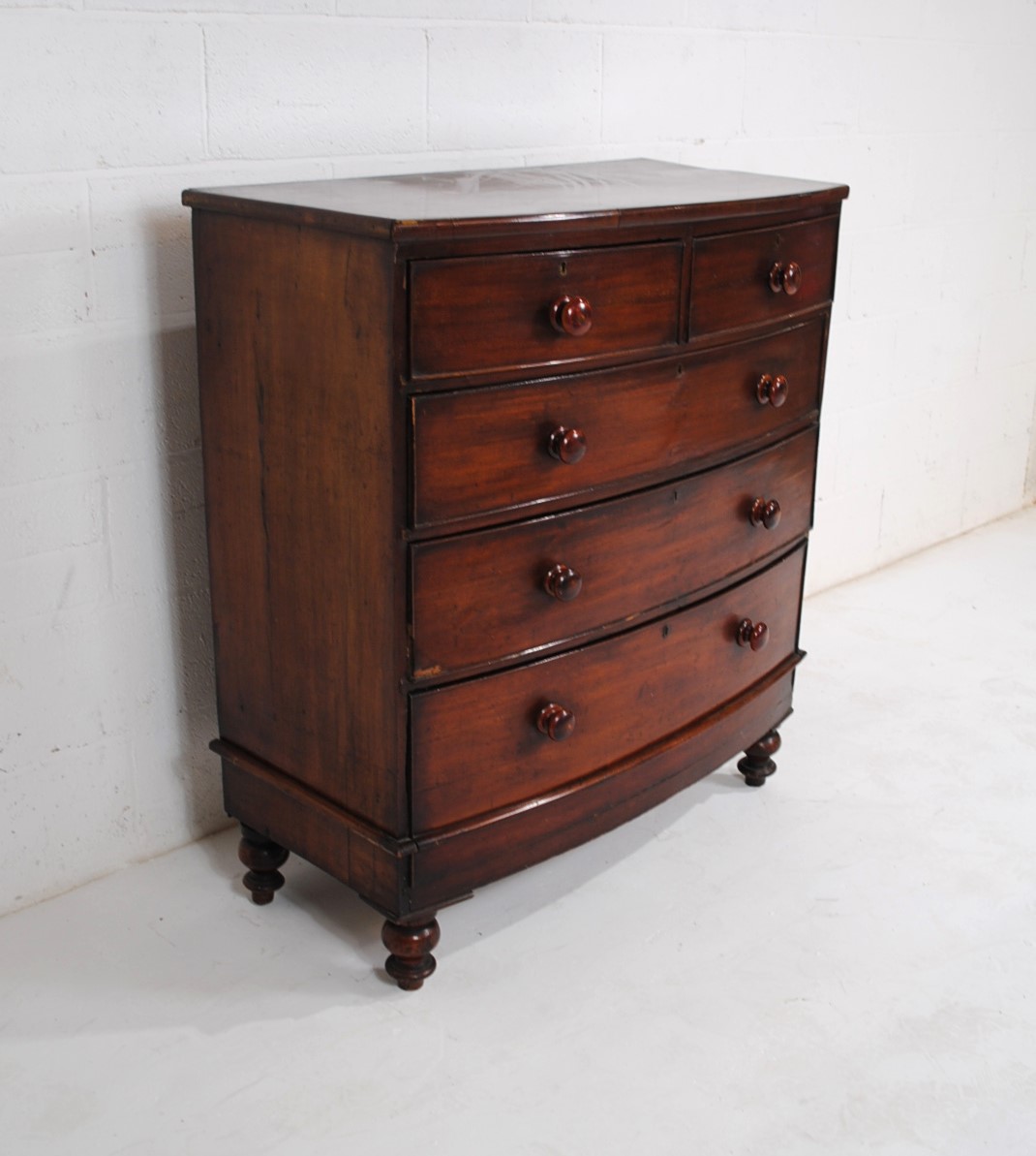 A Victorian mahogany bow-fronted chest of five drawers, raised on turned legs - one leg loose but - Image 3 of 8