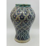 A large pottery Islamic vase - height 40cm