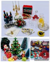 A collection of dolls house accessories all relating to Christmas including trees, presents,