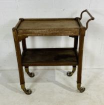 A Hotel & General Supply Company tea trolley with sliding tray and brass handle