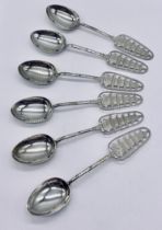 A set of 6 Eastern silver spoons each topped with a pagoda