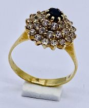 A sapphire and clear stone cluster ring set in 9ct gold, size G 1/2