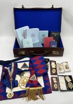 A collection of Masonic regalia including apron, books and numerous jewels including larger silver