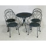 A metal garden bistro set with four chairs