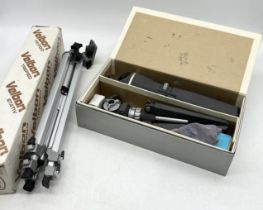 A boxed spotting scope and tripod with accessories