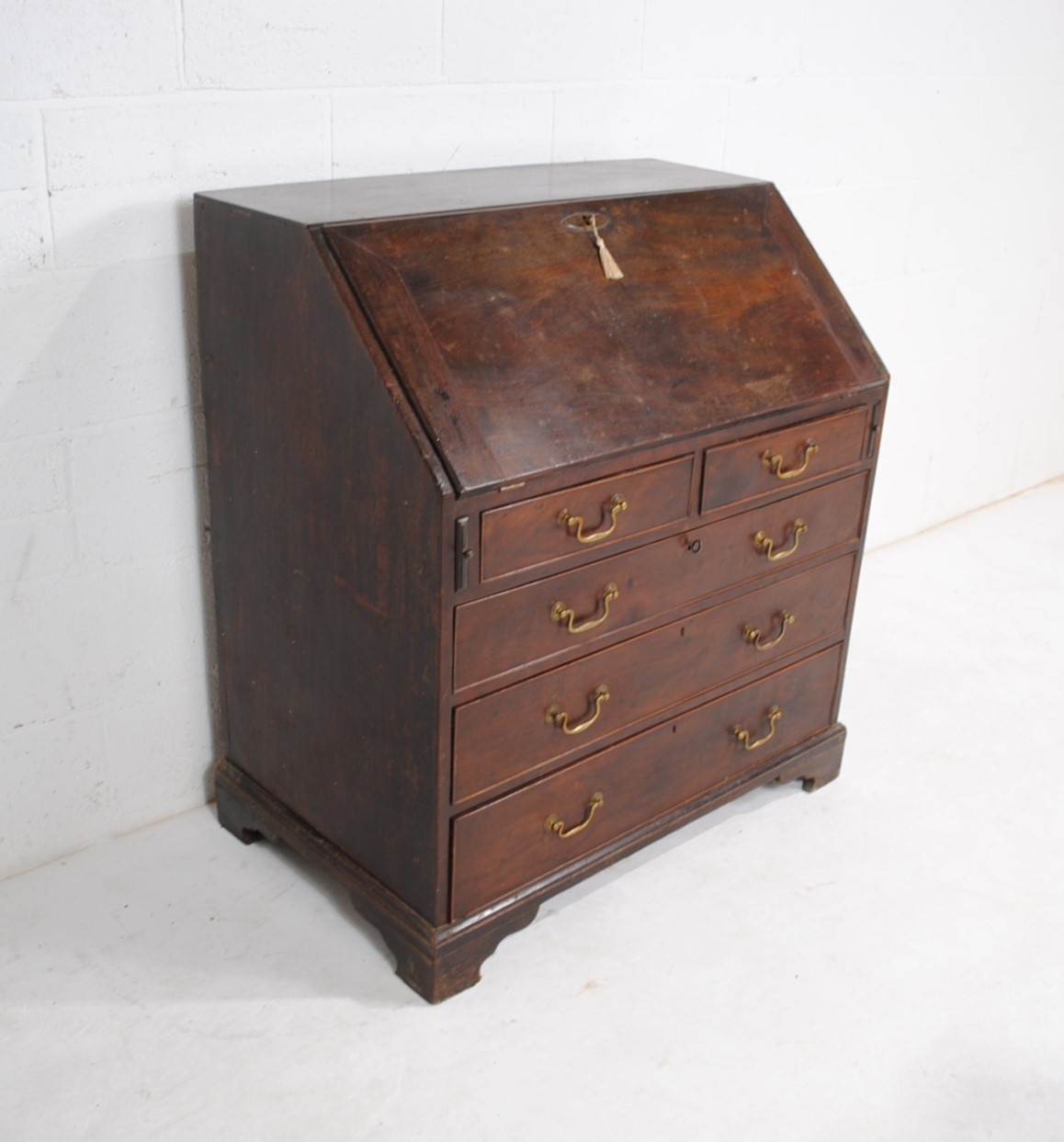 A Georgian mahogany bureau, with five drawers with brass handles, raised on bracket feet, with - Image 3 of 9