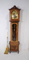 A modern longcase clock, with brass dial marked 'Tempus Fugit', with carved detailing - height