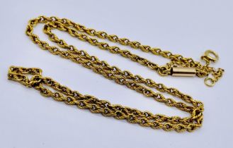 A 15ct gold necklace with safety chain, total weight 9.2g