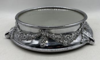 An early 20th Century silver plated and mirrored cake stand with mahogany base, diameter of mirrored