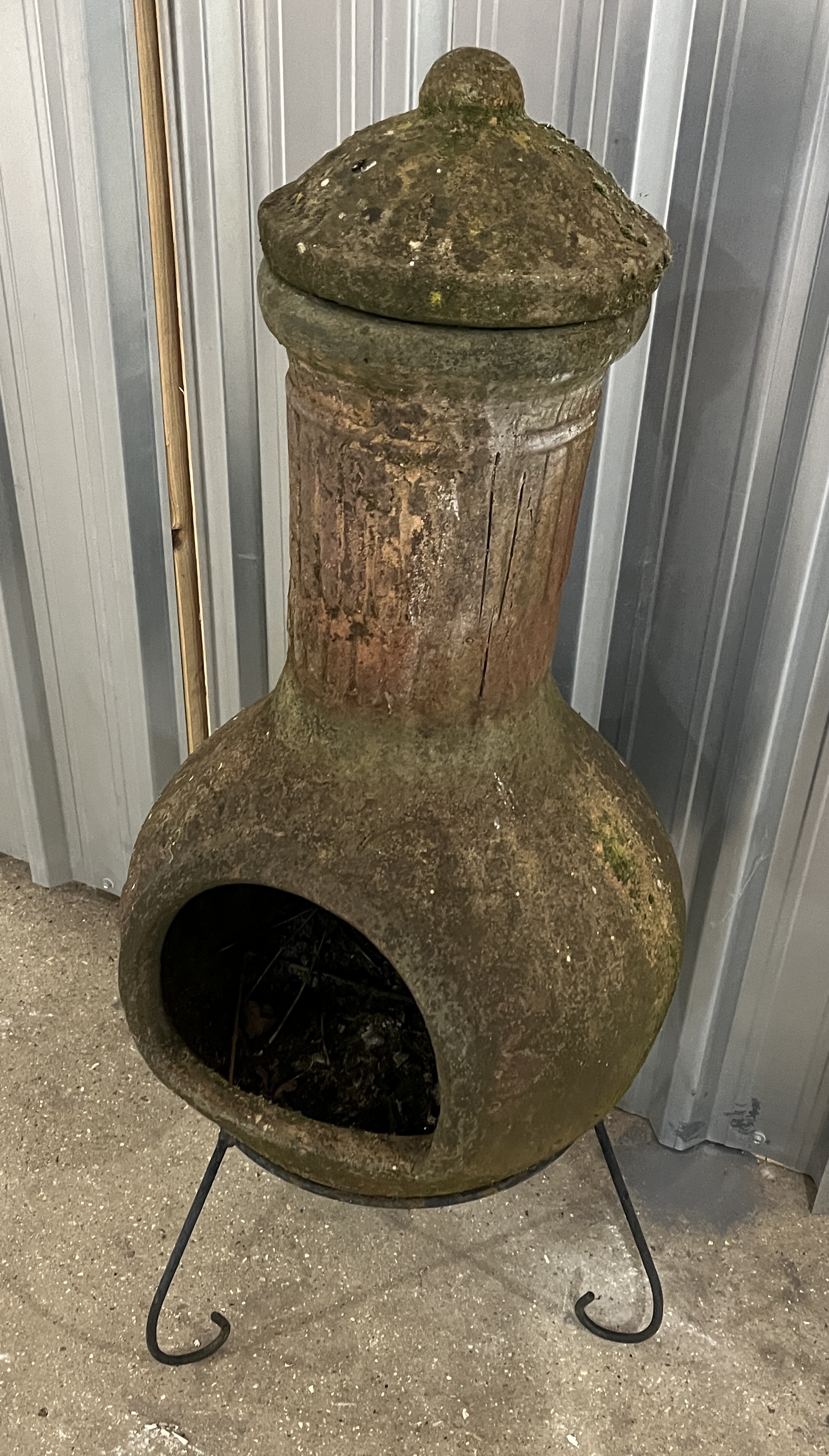 A weathered terracotta chiminea on wrought iron tripod stand - Image 3 of 4