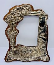A hallmarked silver photo frame "Friendship is a sheltering tree" with repousse decoration, height
