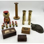 A collection of various items including trench art shells, miniature skittle set in the form of a