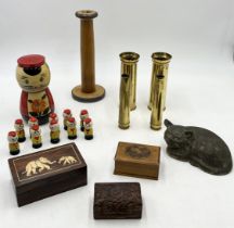 A collection of various items including trench art shells, miniature skittle set in the form of a